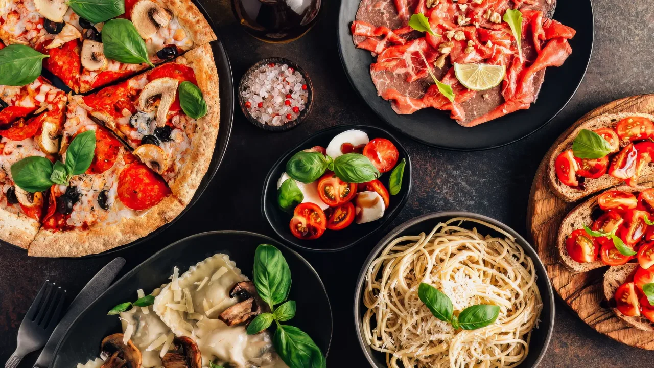 Most popular foods; Pizza, pasta, spaghetti, tomato, traditional cheese like mozzarella in Italian cuisine.