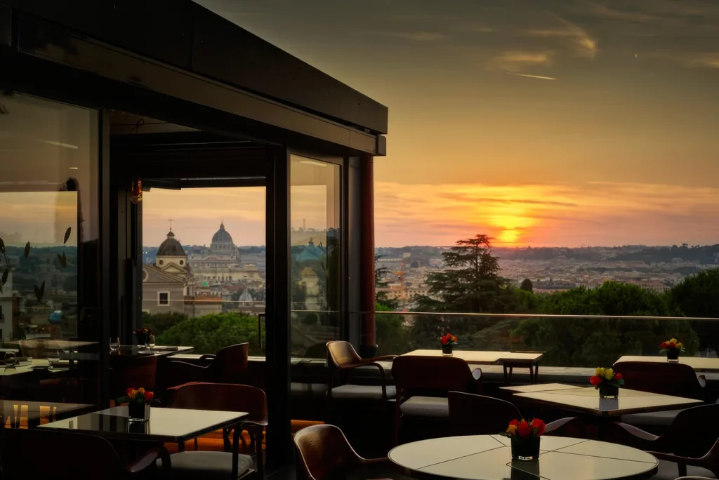 Exterior view of Hotel Eden Rome with lush greenery and elegant architecture