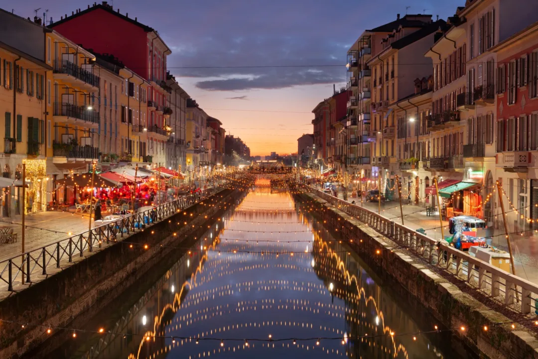 The enchanting Navigli Canal at twilight, reflecting the city's romantic ambiance.